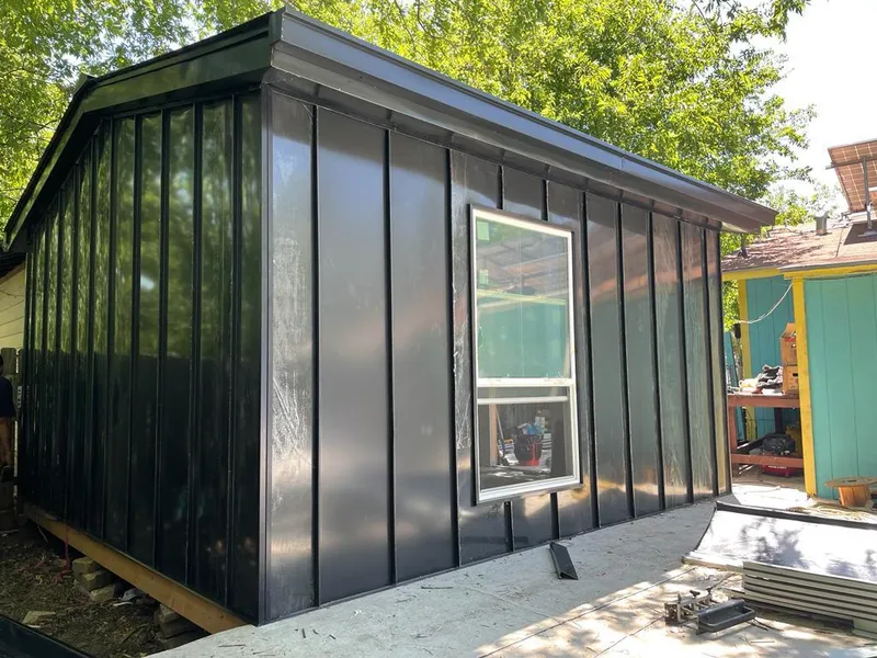 Black standing seam metal wall panels for Roof Inspection in Woods Creek