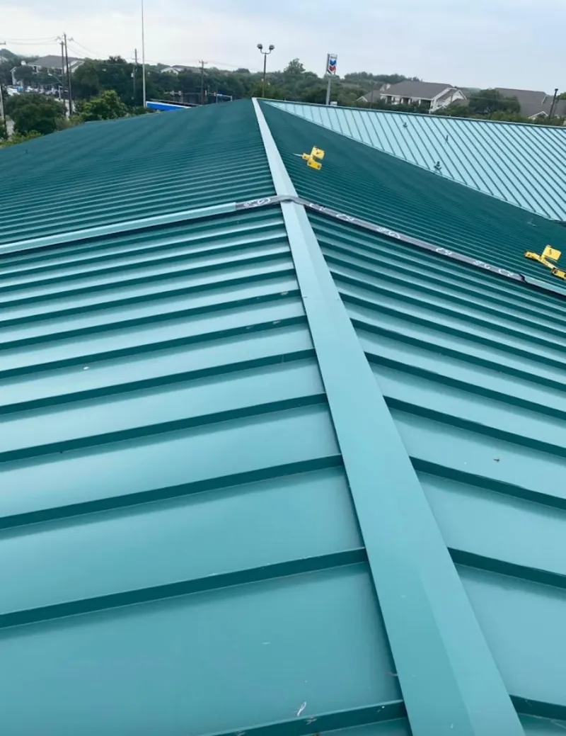 Green commercial metal roof ridge and valley for Metal Roof Repair in Woods Creek